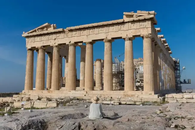 Lady sitting in front of Parthenon on Acropolis, Athens, Greece Kristoffer Trolle athens photo