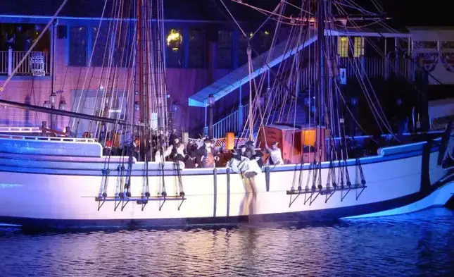 Tea being dumped over the side of the Beaver during the reenactment of the Boston Tea Party on December 16, 2012 leewrightonflickr boston tea-party photo